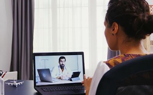 Photo of patient having a virtual appointment with doctor